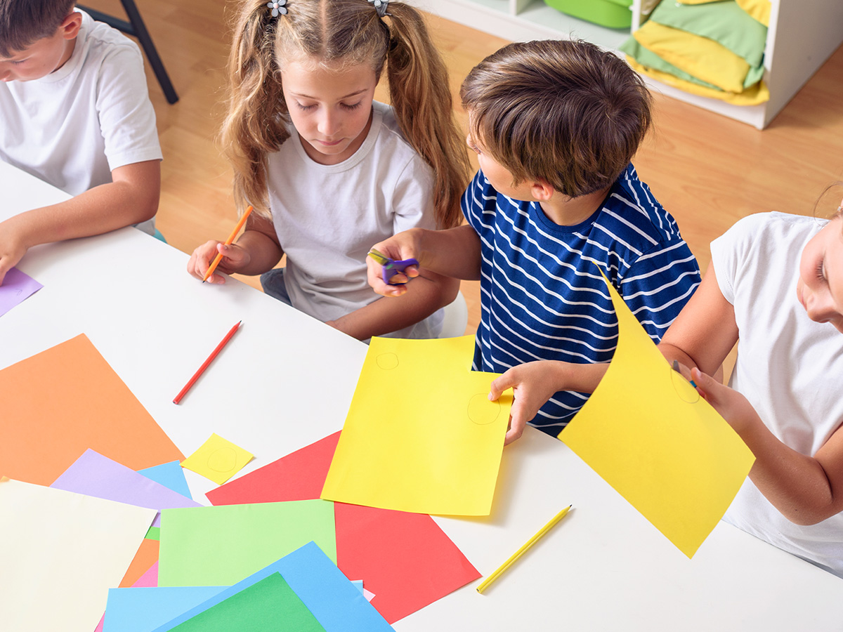 kids cutting out paper activity