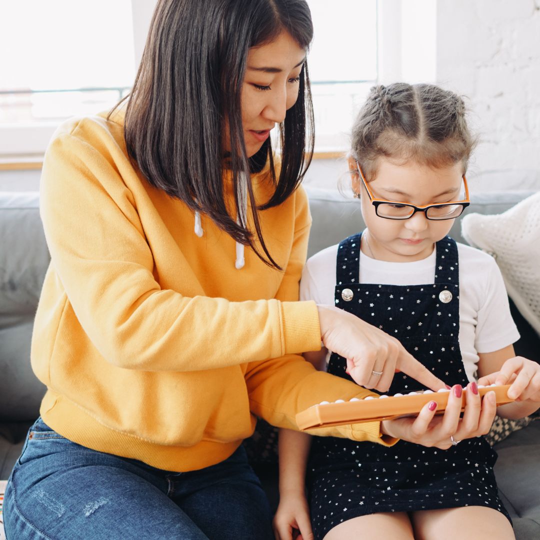 kid learning on tablet