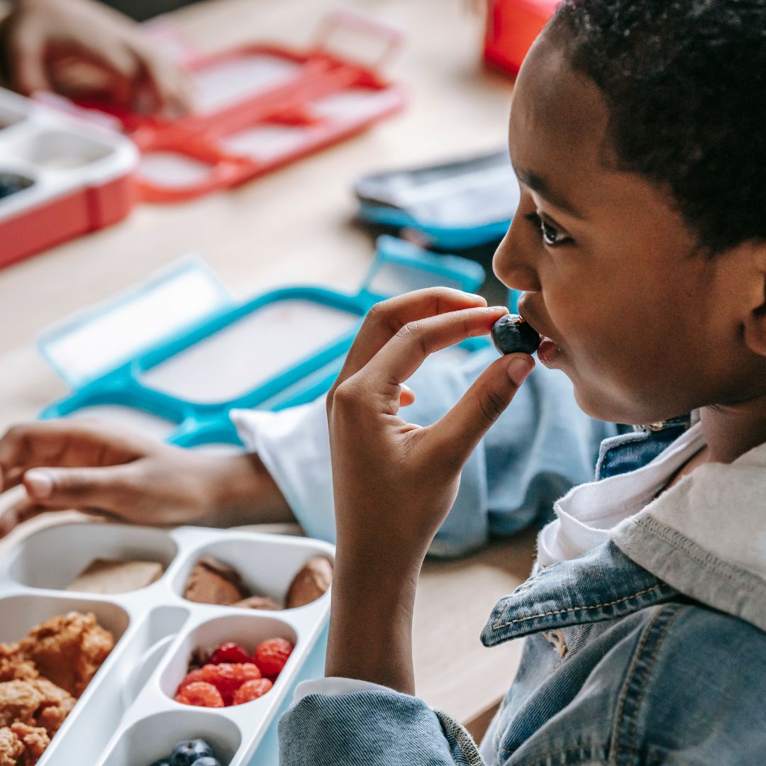 kid eating fruit