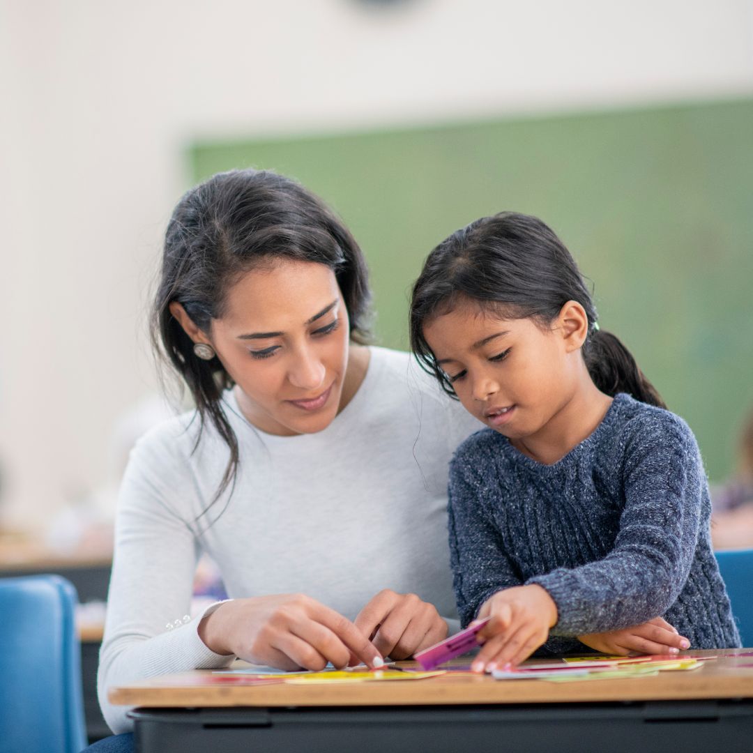 teacher helping student