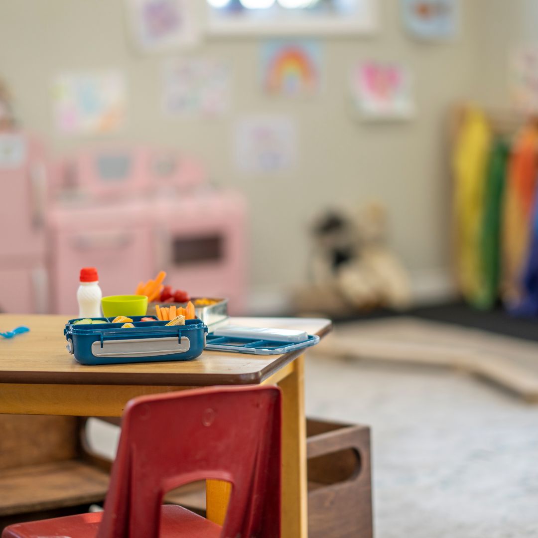 Close up of daycare desk, which is covered in art supplies