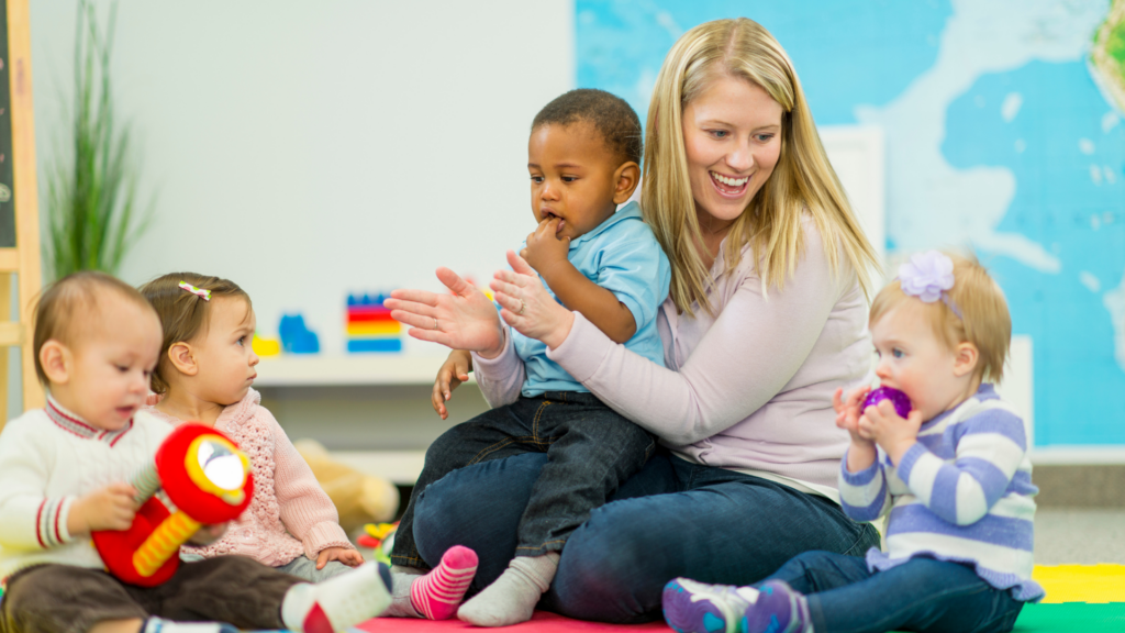 Kids surrounding a daycare teacher.