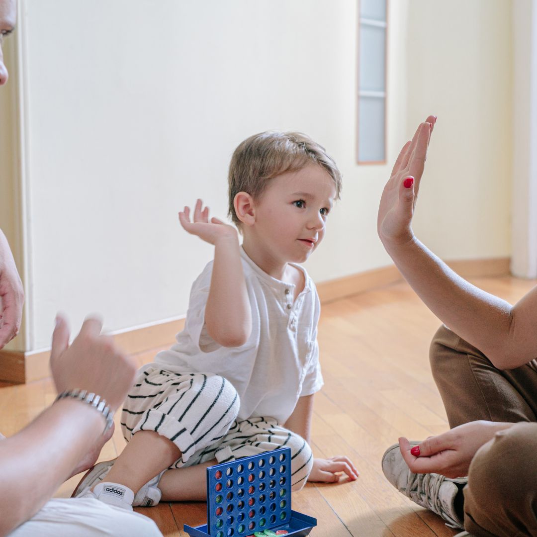 child high fiving