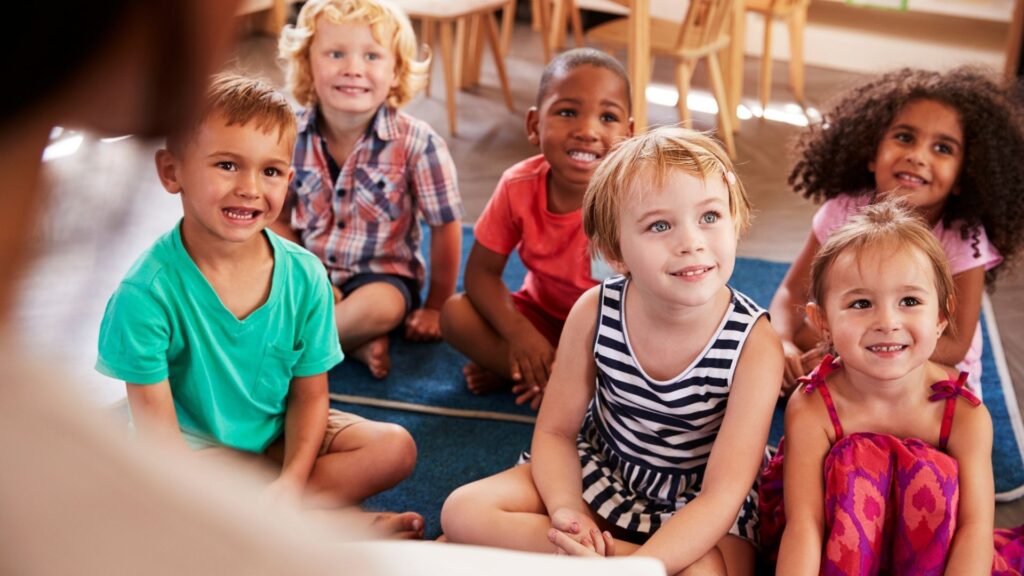 Children listening to someone reading a story.