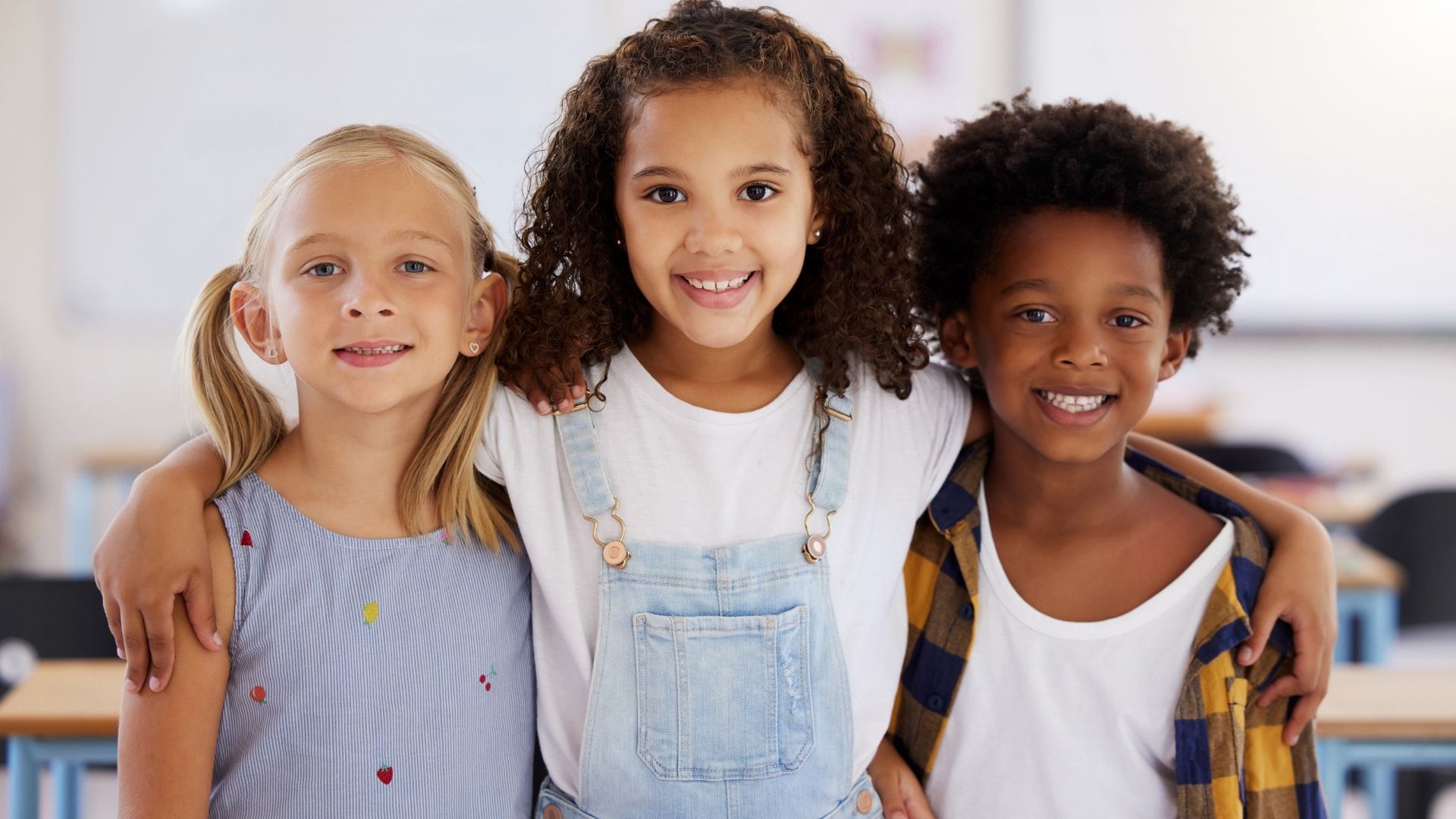3 students smiling
