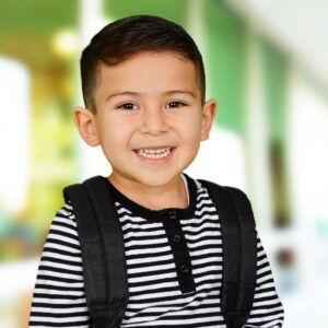 little boy wearing a backpack